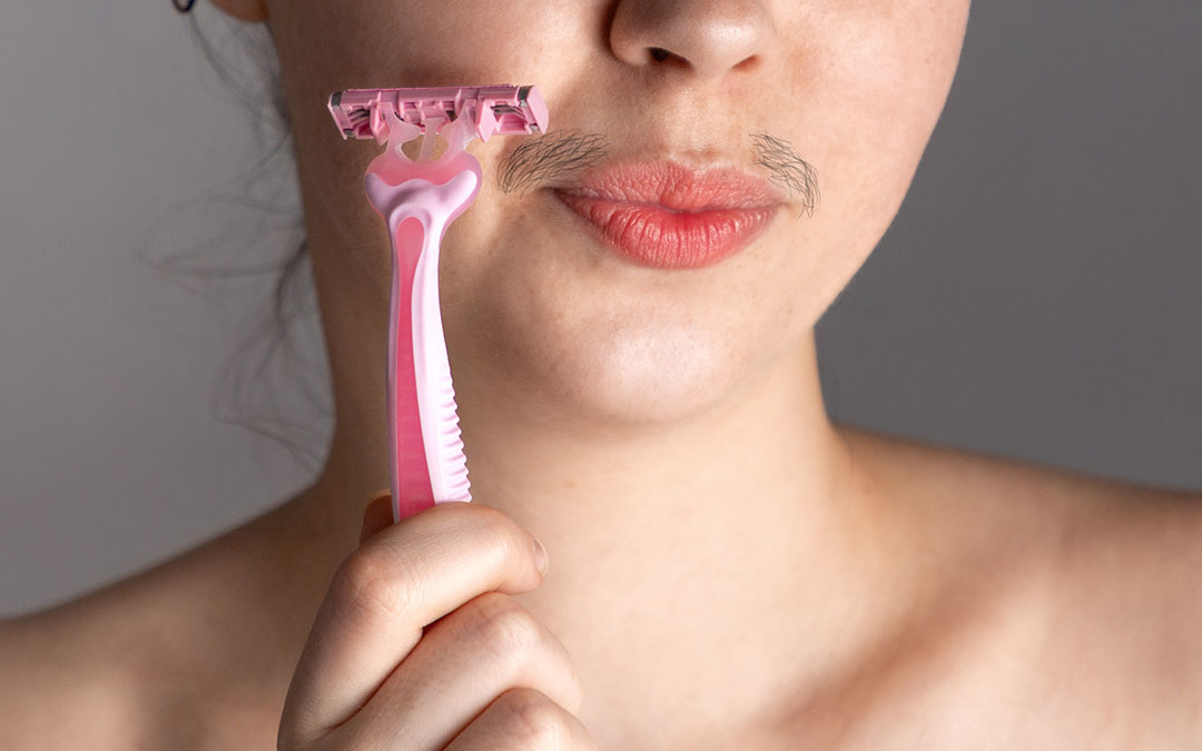 Why do hormones affect face and body hair growth?
